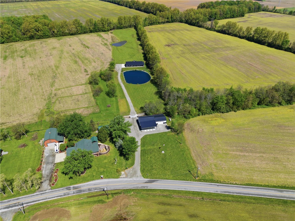 1602 Westboro Road Blanchester, OH 45107 - Photo 61 of 81 Vast green fields surround properties with private ponds, creating a serene and expansive setting.
