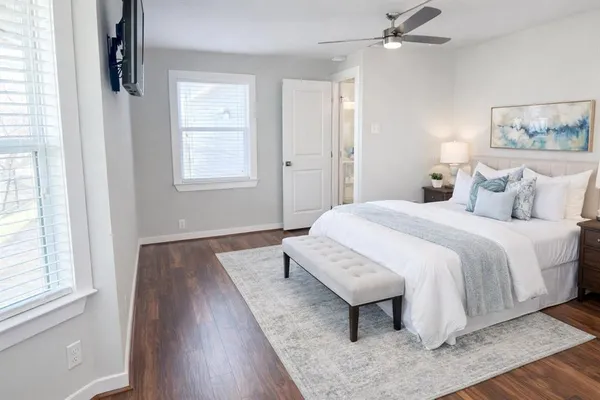 a bedroom with a bed and window