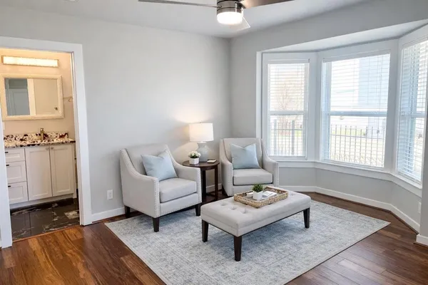 a living room with furniture and a window