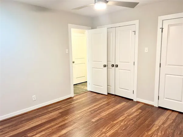 an empty room with wooden floor