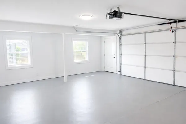 a view of a livingroom with an empty space and a window