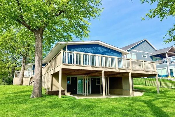 a view of an house with backyard porch and sitting area