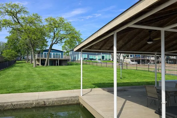 a view of a house with backyard and porch