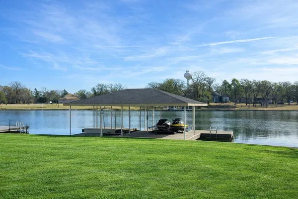 a view of a lake with houses in the background