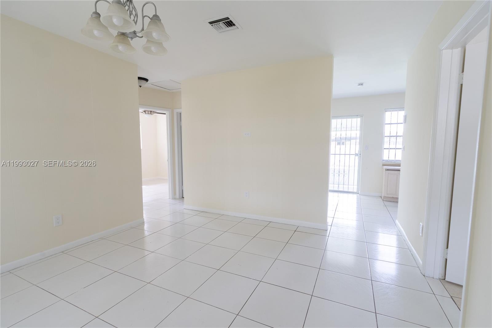 11770 Southwest 168th Street, Unit 11770 Miami, FL 33177 - Photo 1 of 22 a view of a hallway with a chandelier