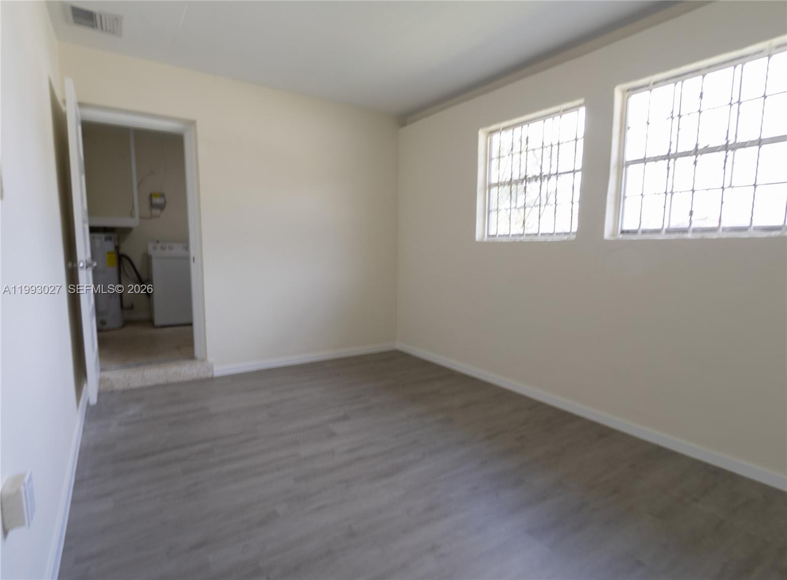 11770 Southwest 168th Street, Unit 11770 Miami, FL 33177 - Photo 20 of 22 an empty room that has a window