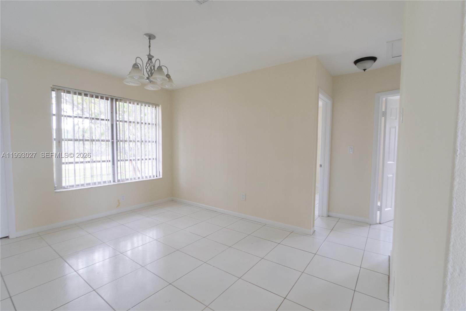 11770 Southwest 168th Street, Unit 11770 Miami, FL 33177 - Photo 2 of 22 a view of an empty room with a window