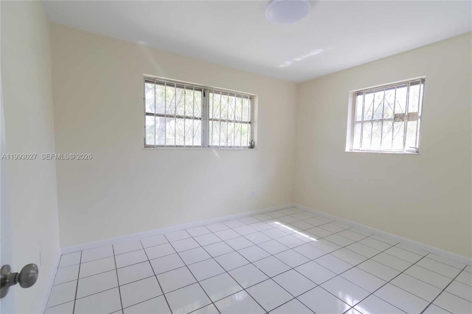 11770 Southwest 168th Street, Unit 11770 Miami, FL 33177 - Photo 3 of 22 a view of an empty room and window