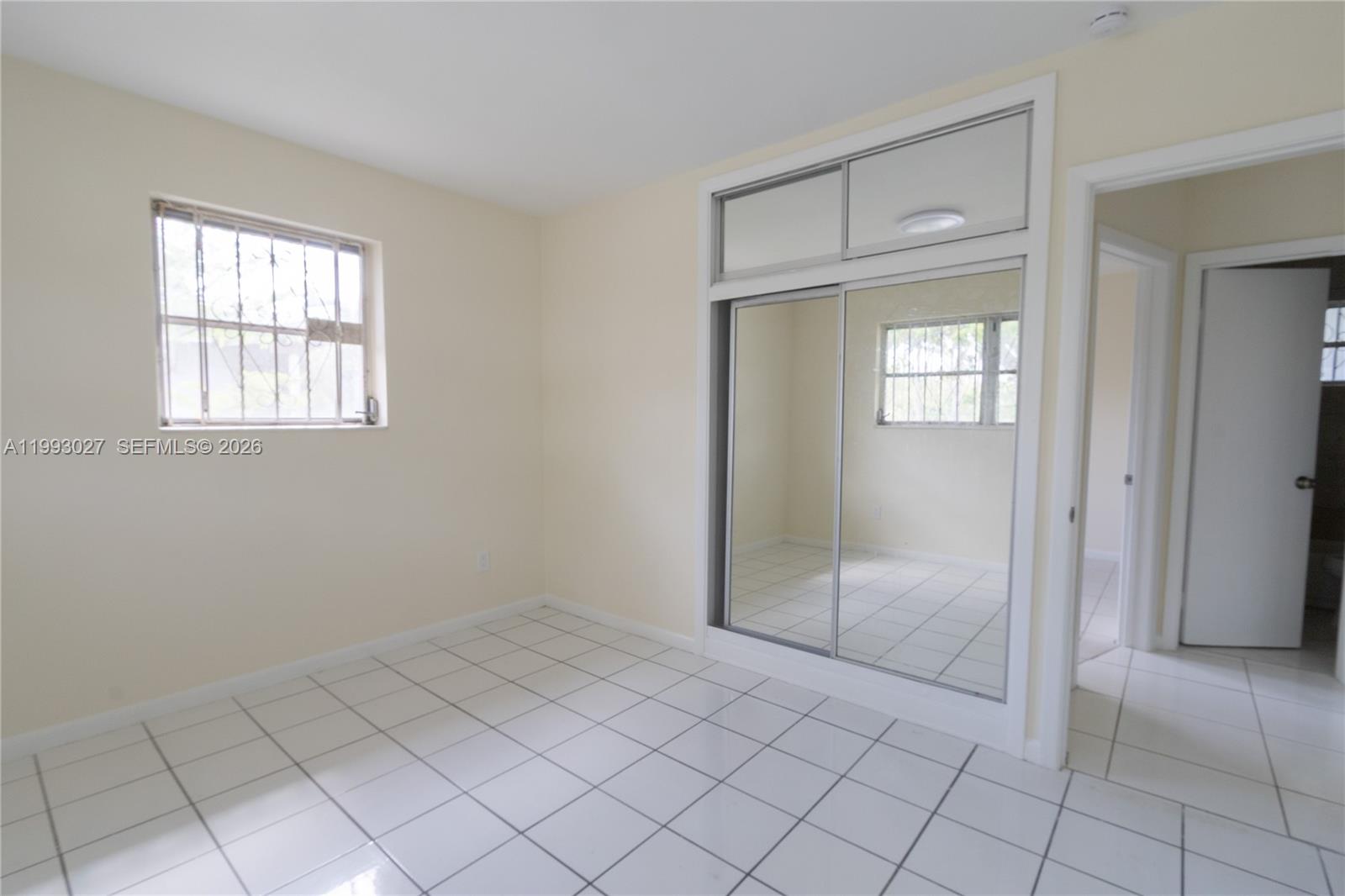11770 Southwest 168th Street, Unit 11770 Miami, FL 33177 - Photo 4 of 22 a view of an empty room with window