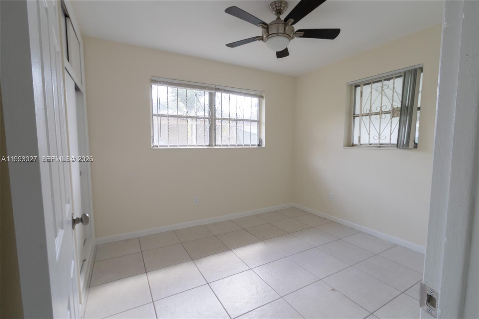 11770 Southwest 168th Street, Unit 11770 Miami, FL 33177 - Photo 6 of 22 a view of an empty room with a window