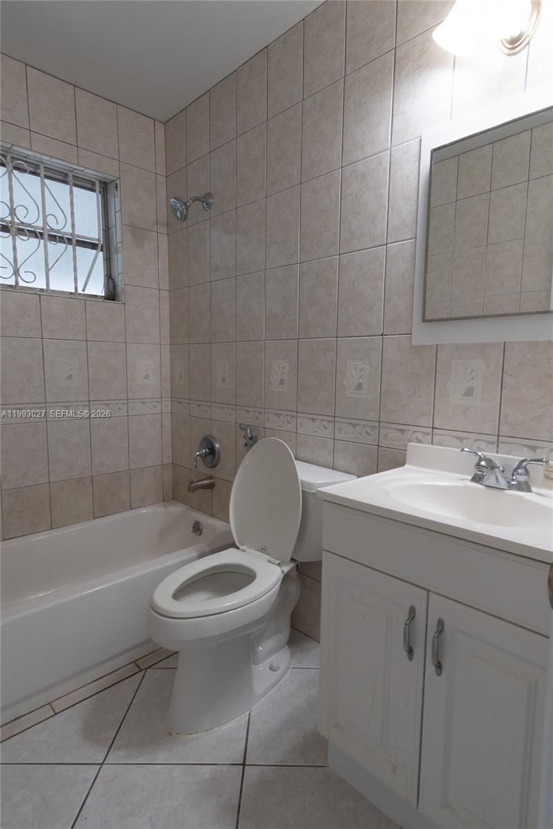 11770 Southwest 168th Street, Unit 11770 Miami, FL 33177 - Photo 7 of 22 a bathroom with a sink toilet and shower