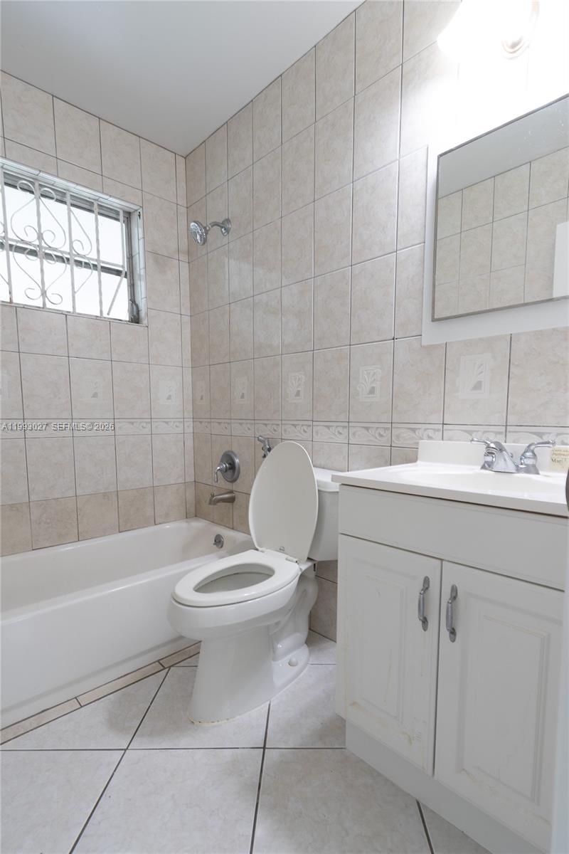 11770 Southwest 168th Street, Unit 11770 Miami, FL 33177 - Photo 8 of 22 a bathroom with a sink toilet and shower