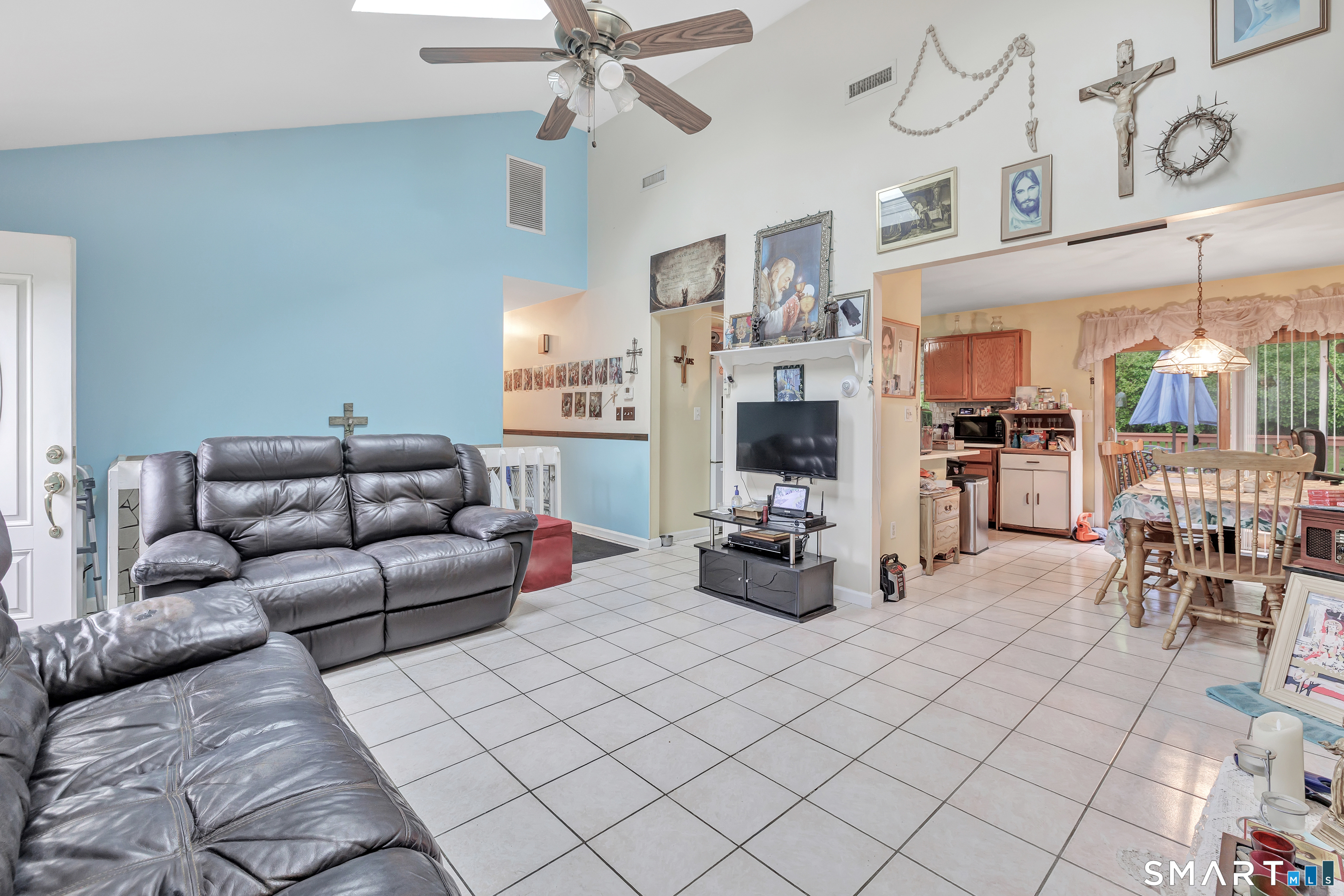 123 River Road Shelton, CT 06484 - Photo 3 of 27 a living room with furniture and a flat screen tv