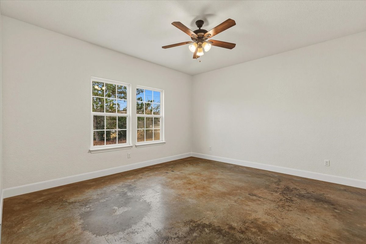 207 Cardinal Loop Paige, TX 78659 - Photo 14 of 39 an empty room with a window