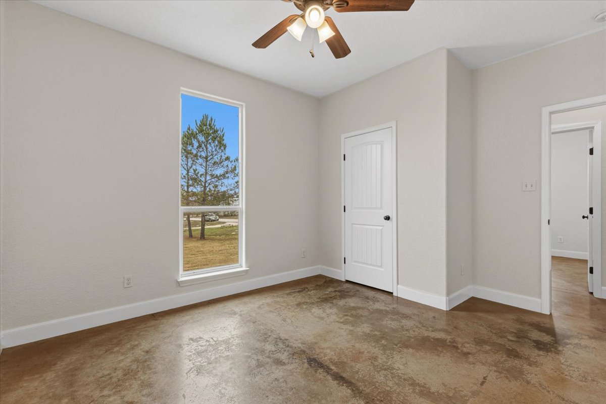 207 Cardinal Loop Paige, TX 78659 - Photo 27 of 39 a view of an empty room with a window