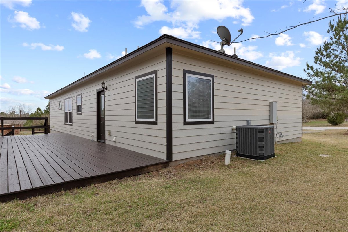 207 Cardinal Loop Paige, TX 78659 - Photo 29 of 39 a front view of a house with garage