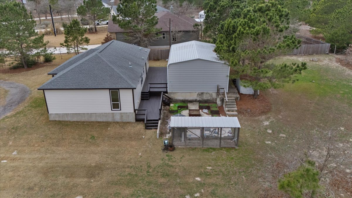 207 Cardinal Loop Paige, TX 78659 - Photo 32 of 39 a aerial view of a house with swimming pool and a yard