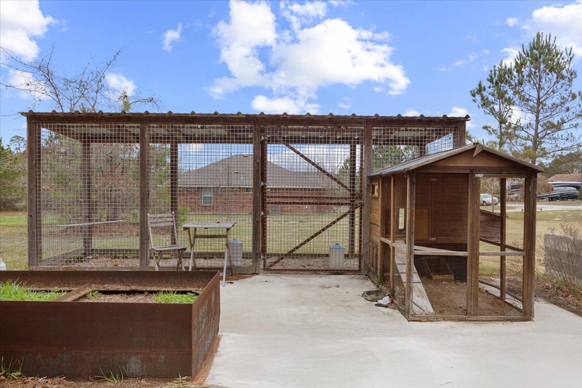 207 Cardinal Loop Paige, TX 78659 - Photo 33 of 39 a view of a room with wooden floor and iron fence
