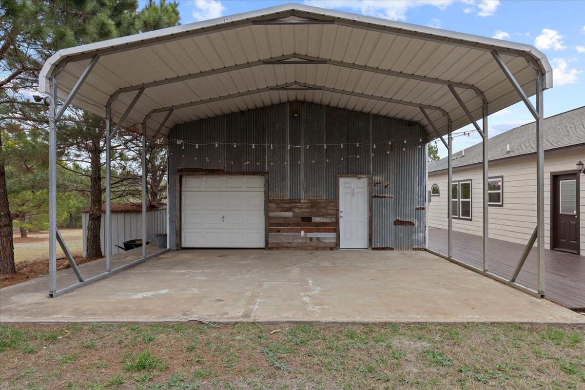 207 Cardinal Loop Paige, TX 78659 - Photo 36 of 39 a view of a house with a garage