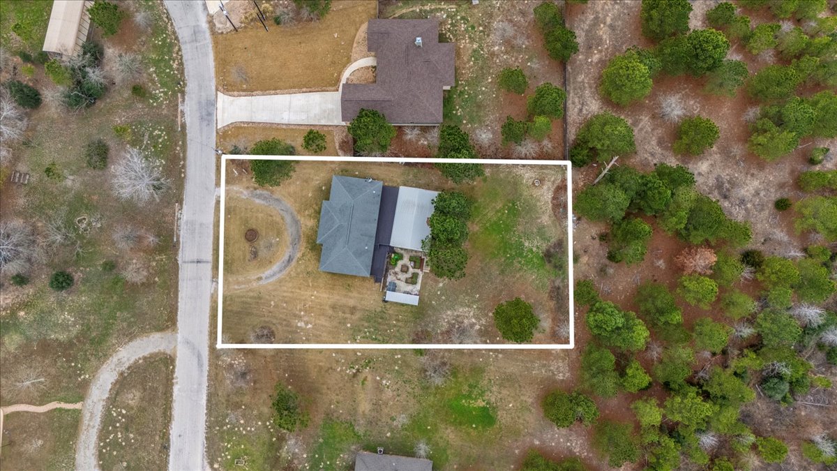 207 Cardinal Loop Paige, TX 78659 - Photo 39 of 39 Aerial view of property and surrounding area with property parcel outlined