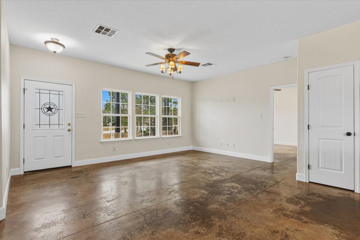 207 Cardinal Loop Paige, TX 78659 - Photo 6 of 39 a view of an empty room with a window
