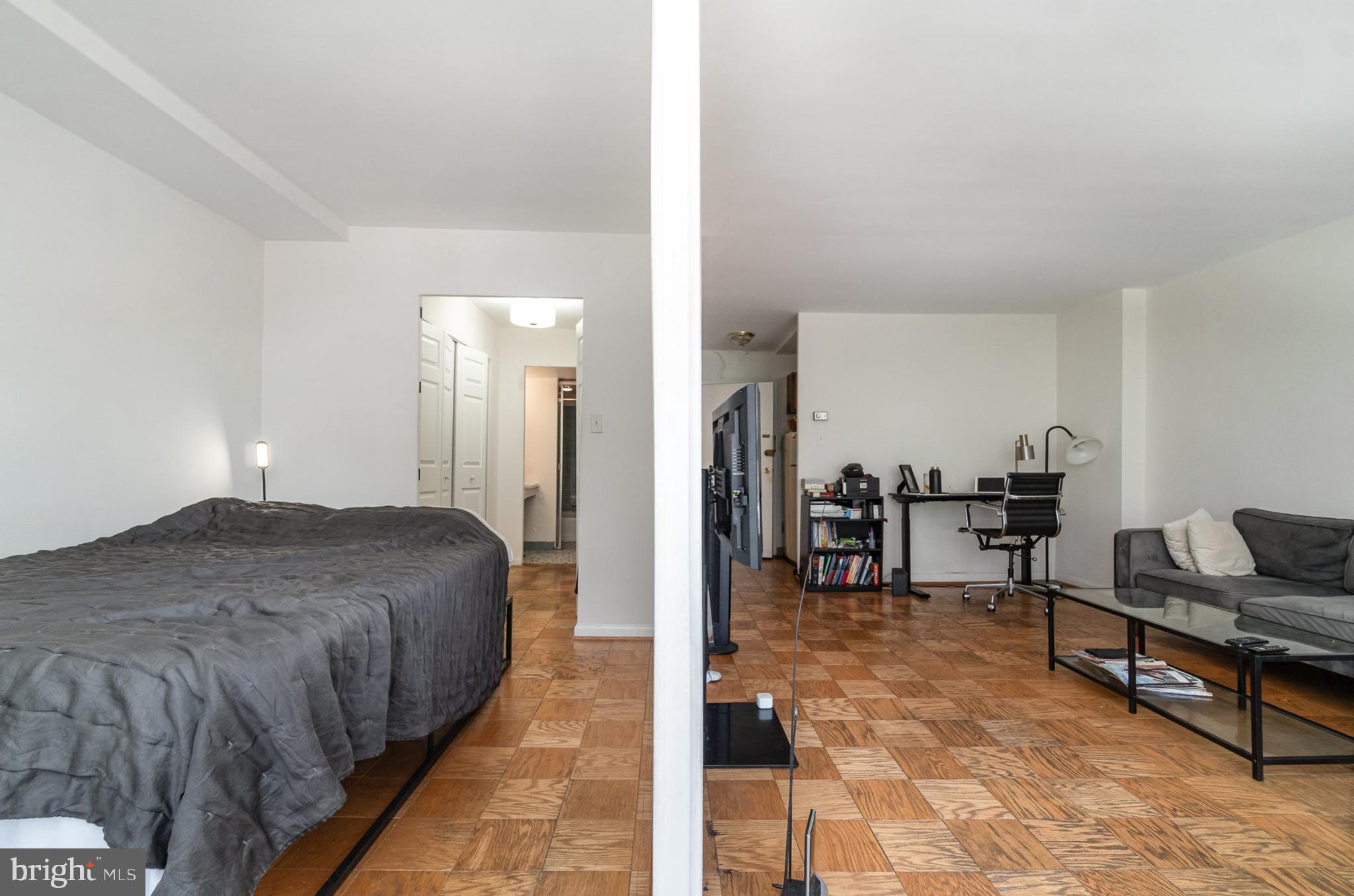 922 24th Street Northwest, Unit 313 Washington, DC 20037 - Photo 12 of 22 a spacious bedroom with a bed and furniture