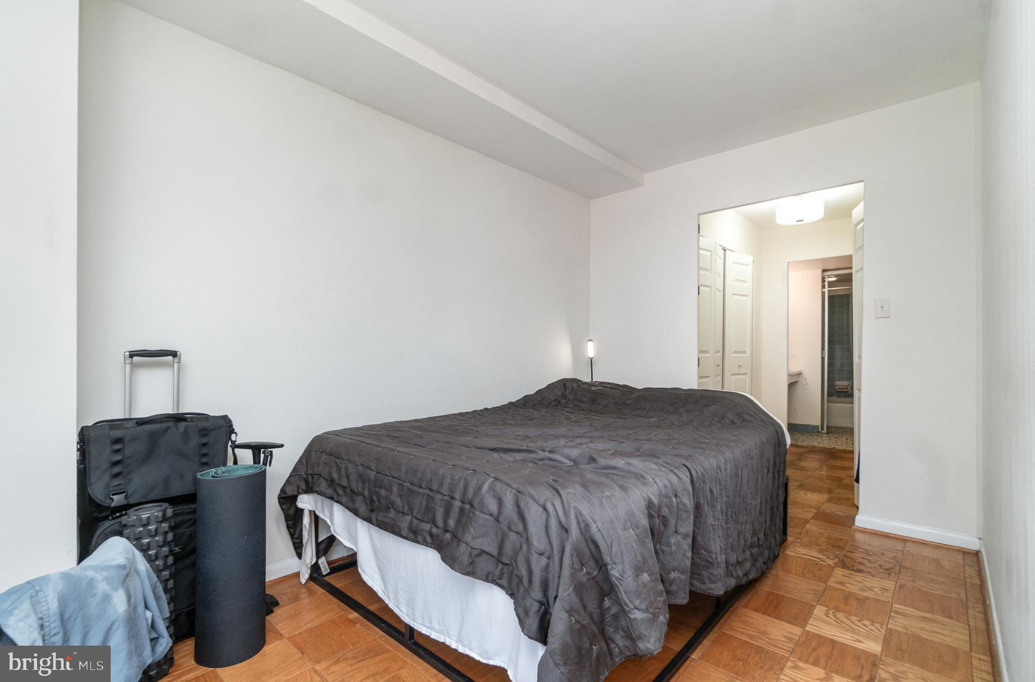 922 24th Street Northwest, Unit 313 Washington, DC 20037 - Photo 13 of 22 a bedroom with a bed and dresser