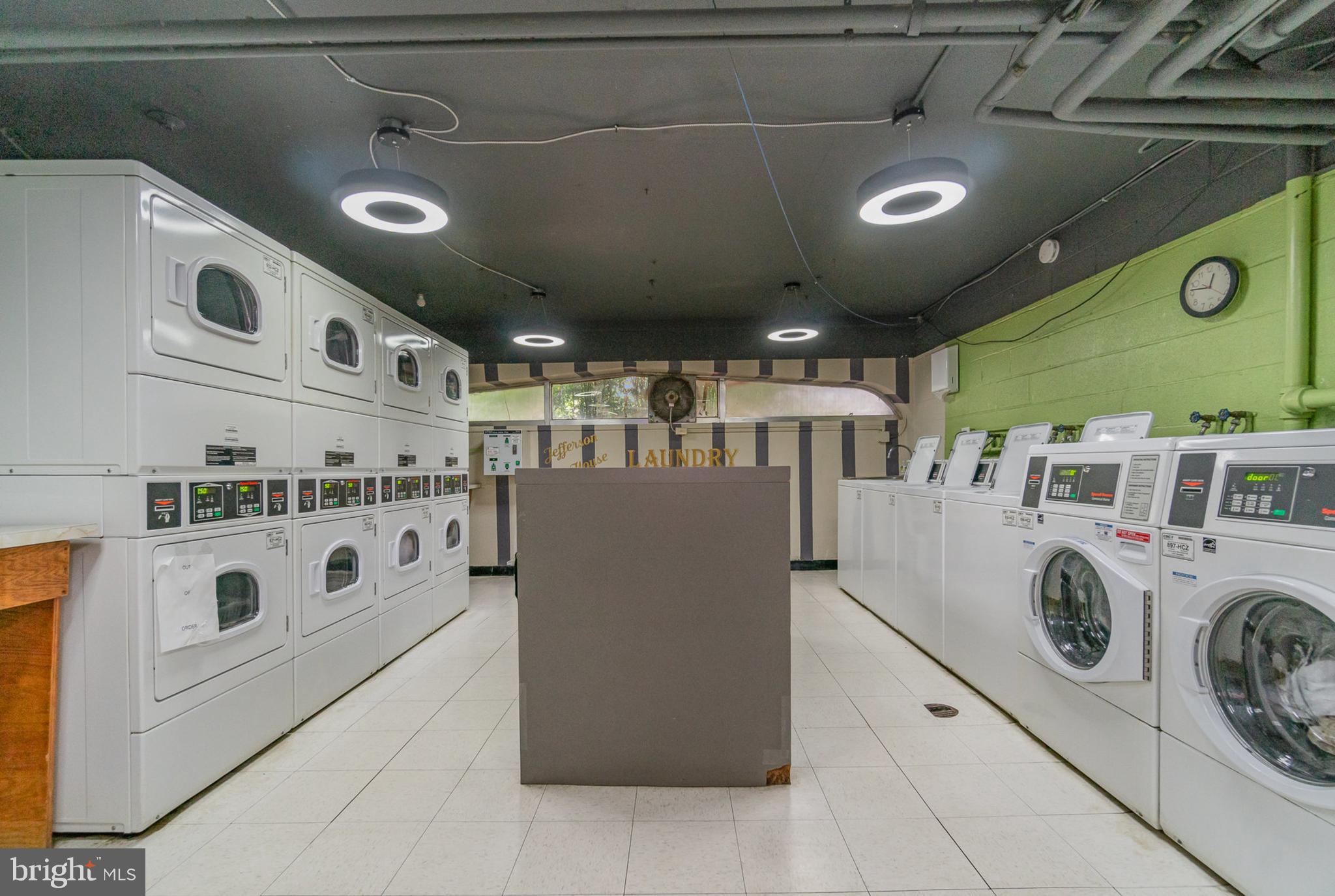 922 24th Street Northwest, Unit 313 Washington, DC 20037 - Photo 16 of 22 a kitchen with stainless steel appliances granite countertop a sink and a stove