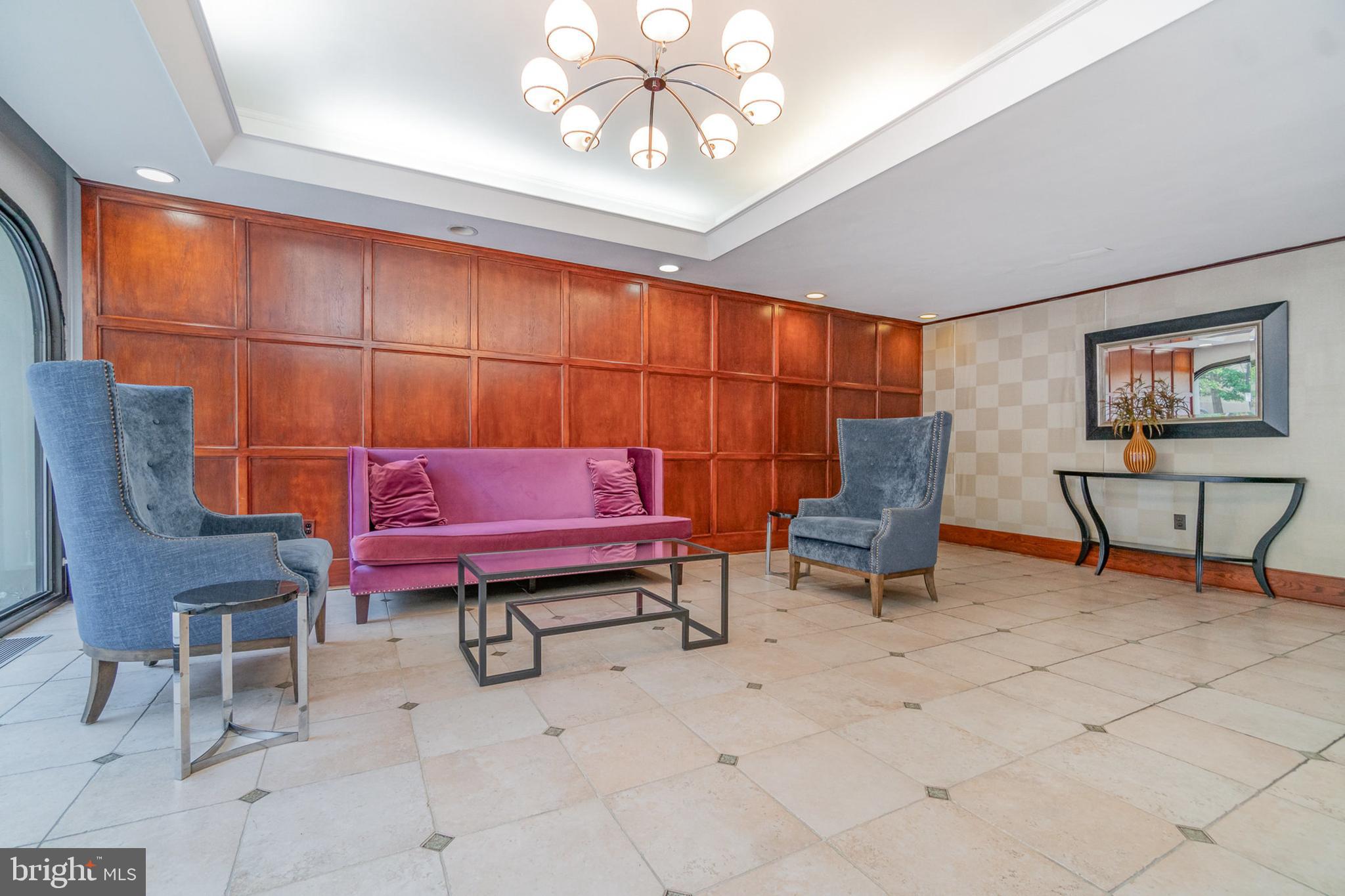 922 24th Street Northwest, Unit 313 Washington, DC 20037 - Photo 3 of 22 a living room with furniture and a rug