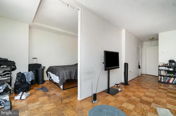 a spacious bedroom with a bed and furniture
