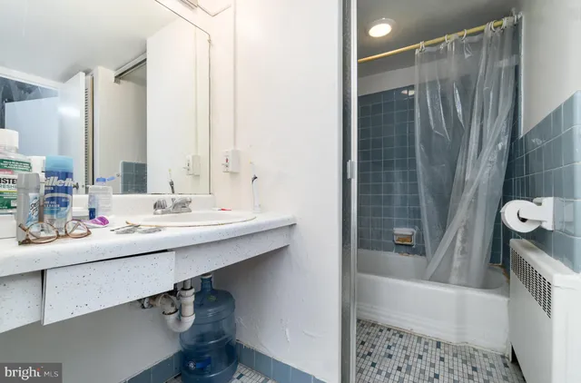 a bathroom with a toilet and bathtub
