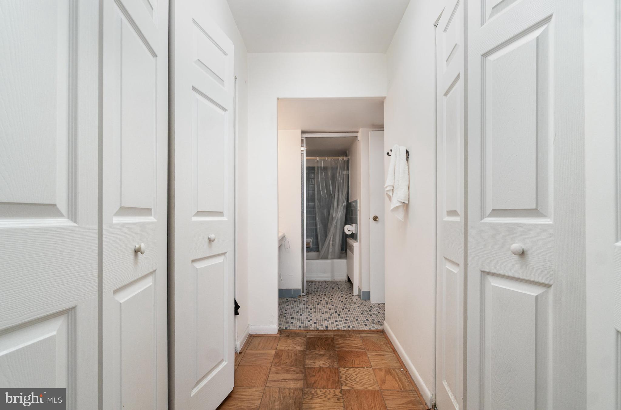 922 24th Street Northwest, Unit 313 Washington, DC 20037 - Photo 10 of 22 a view of a bathroom from a hallway