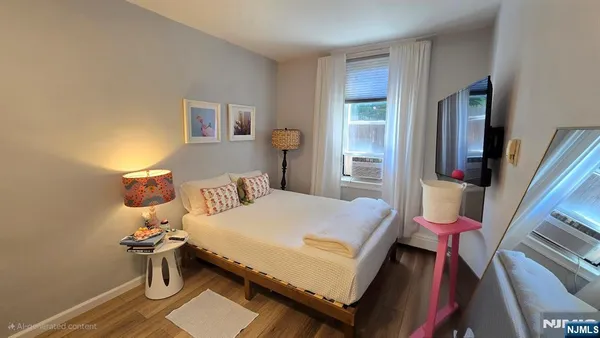 a bedroom with a bed and a view of bathroom