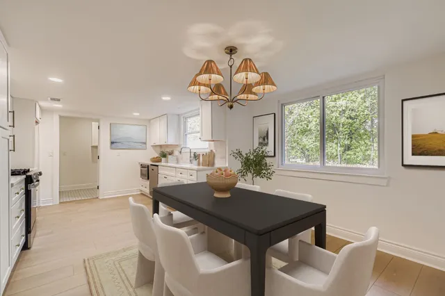 a view of a dining room with furniture window and outside view