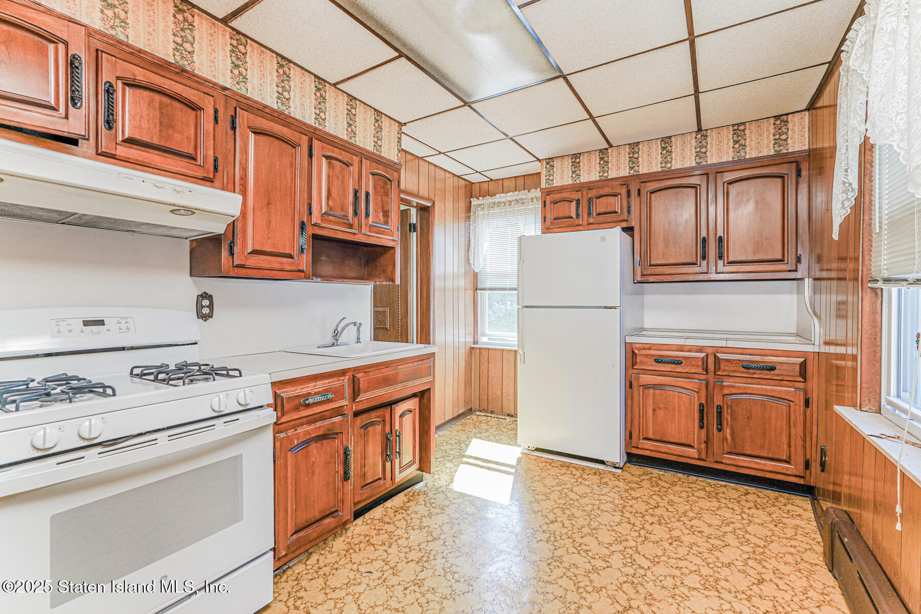 230 Fillmore Street Staten Island, NY 10301 - Photo 11 of 37 a kitchen with stainless steel appliances granite countertop a stove a refrigerator and a cabinets