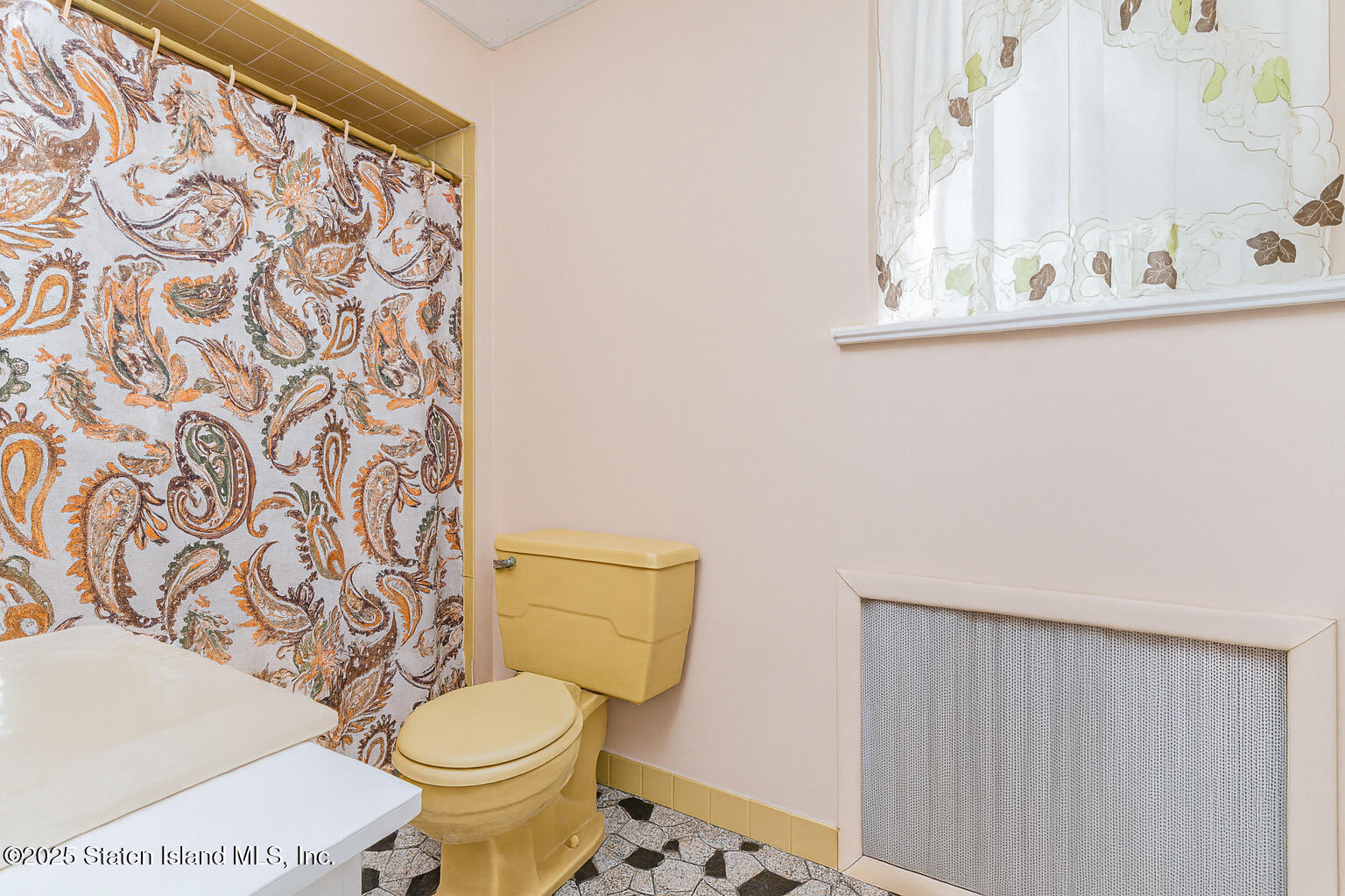 230 Fillmore Street Staten Island, NY 10301 - Photo 12 of 37 a white toilet sitting next to a bathroom sink