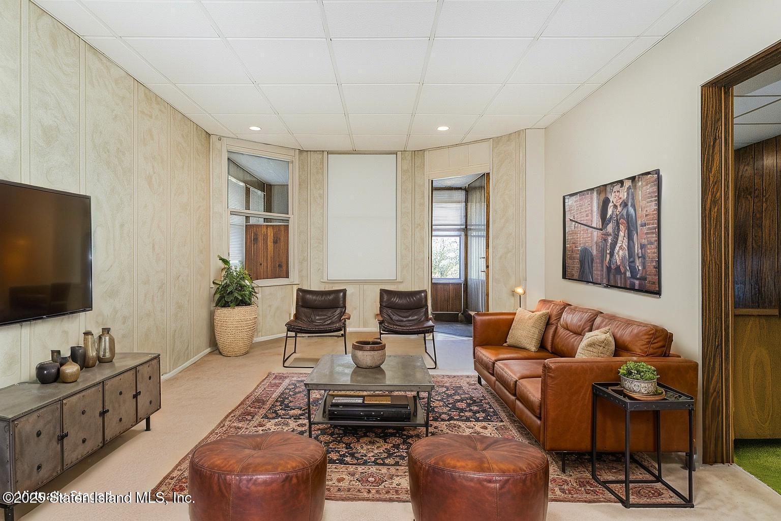 230 Fillmore Street Staten Island, NY 10301 - Photo 14 of 37 a living room with furniture and a flat screen tv