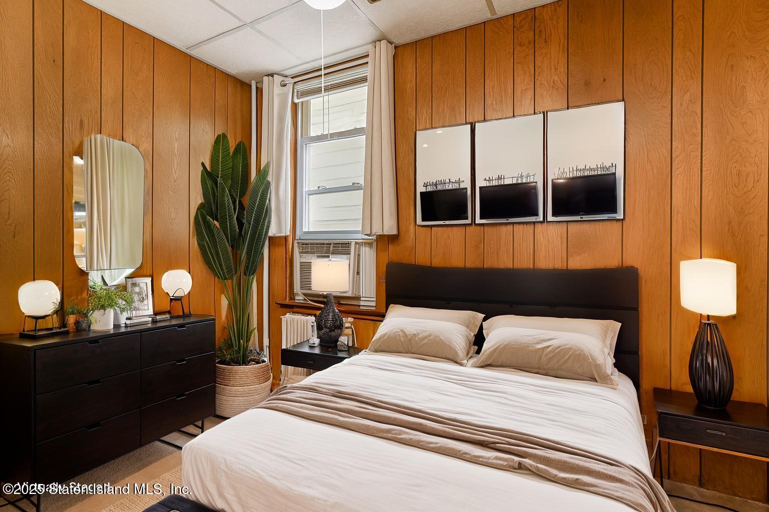 230 Fillmore Street Staten Island, NY 10301 - Photo 18 of 37 a bedroom with a bed and window