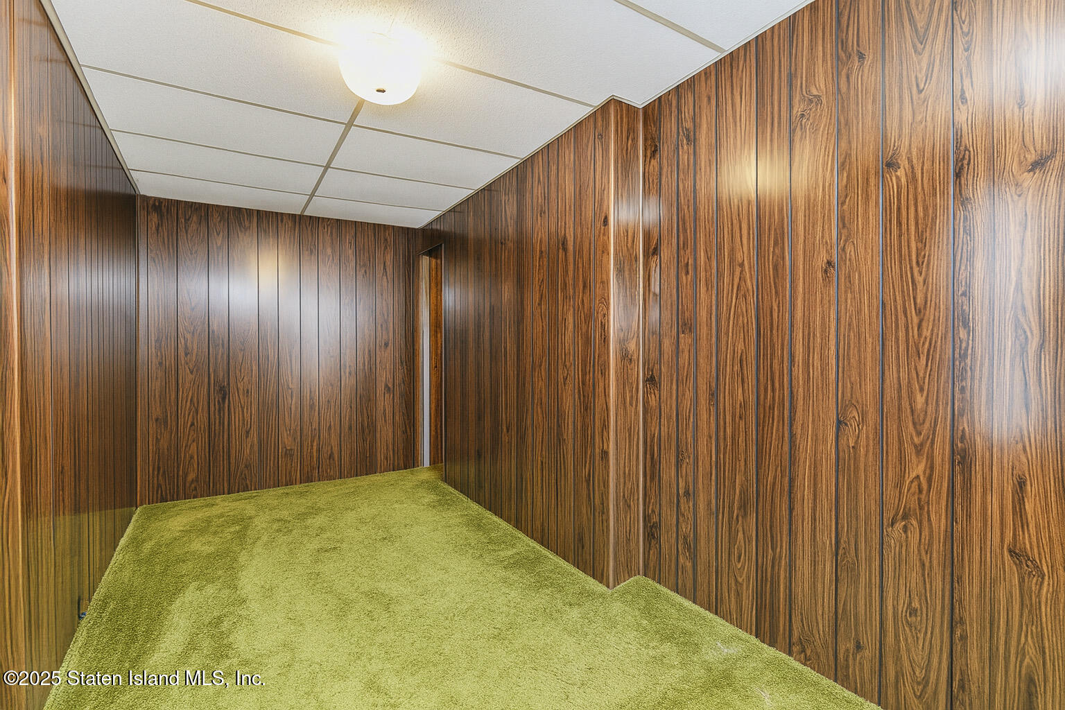 230 Fillmore Street Staten Island, NY 10301 - Photo 20 of 37 a view of an empty room with wooden walls