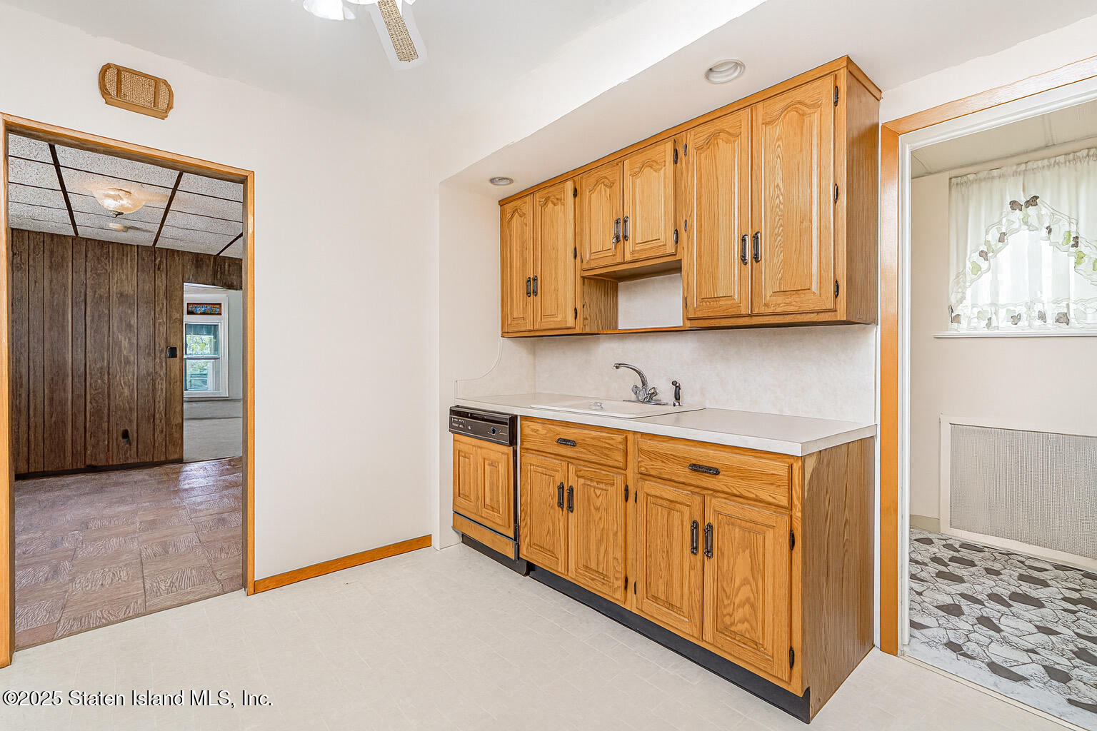 230 Fillmore Street Staten Island, NY 10301 - Photo 26 of 37 a bathroom with a granite countertop sink and a mirror