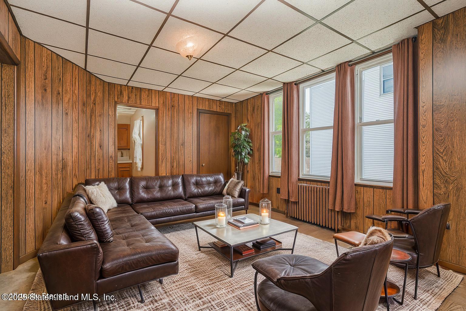230 Fillmore Street Staten Island, NY 10301 - Photo 8 of 37 a living room with furniture and a large window