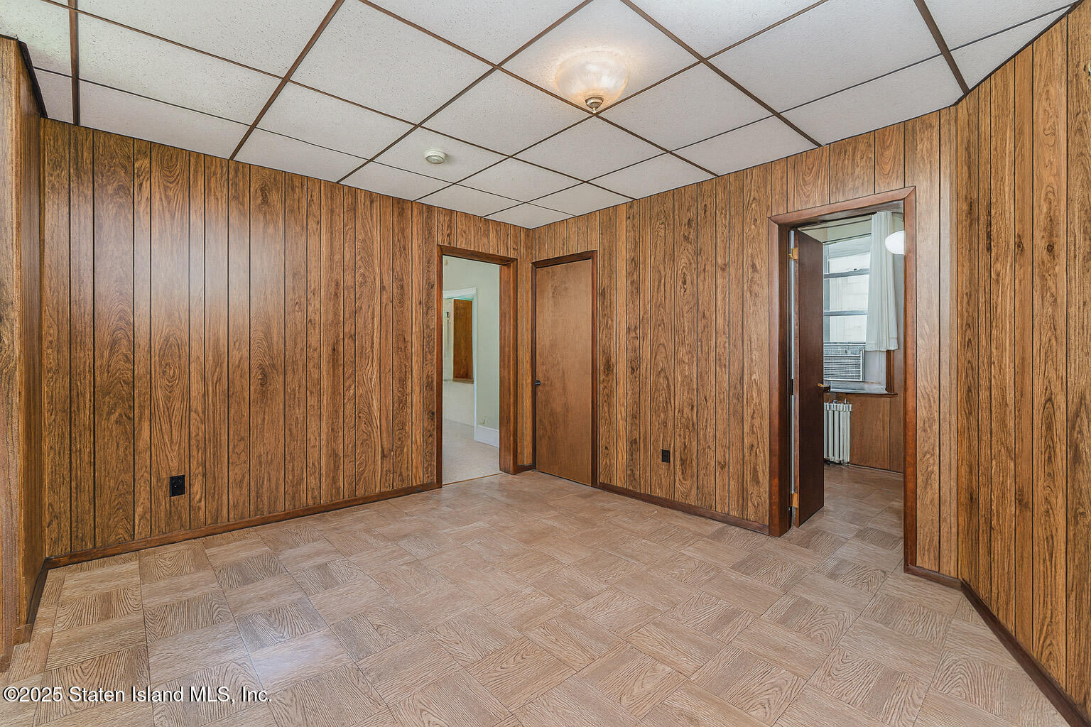 230 Fillmore Street Staten Island, NY 10301 - Photo 9 of 37 a view of an empty room with wooden door