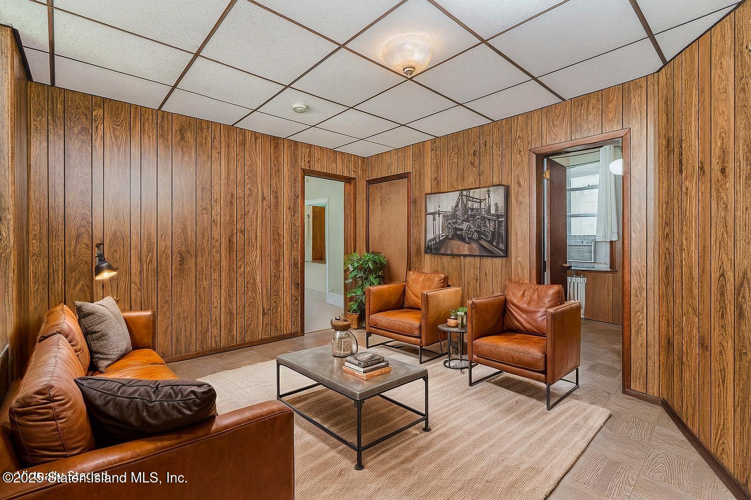 230 Fillmore Street Staten Island, NY 10301 - Photo 10 of 37 a living room with furniture and a painting on the wall