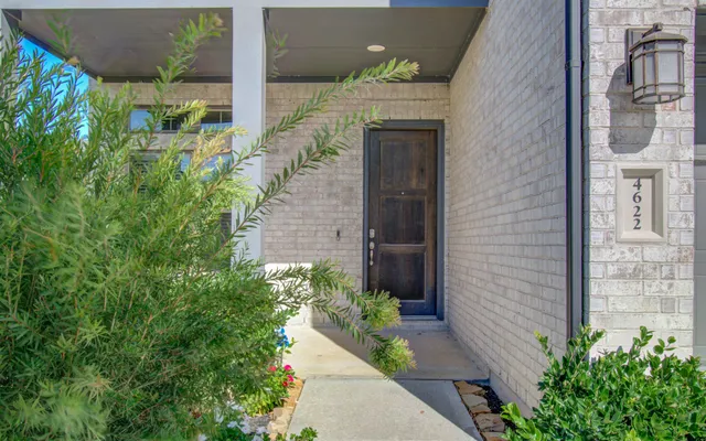 a entryway with flower plants
