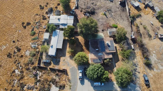 an aerial view of residential house with outdoor space