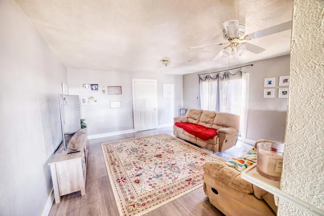 a bedroom with furniture and a chandelier