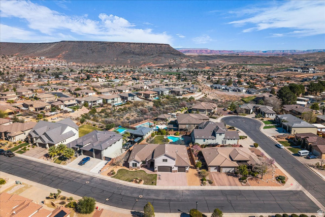 691 Rainier Drive St. George, UT 84770 - Photo 23 of 24 Aerial perspective of suburban area featuring mountains