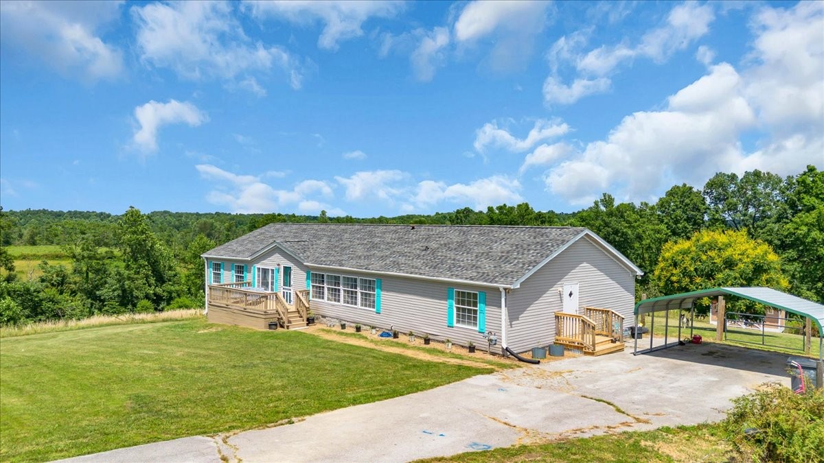 2657 Oak Grove Road Red Boiling Springs, TN 37150 - Photo 38 of 45 a front view of a house with a garden