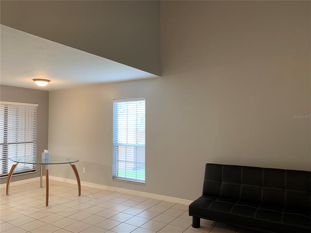 5754 Southwest 8th Place Gainesville, FL 32607 - Photo 9 of 29 a living room with furniture and a window