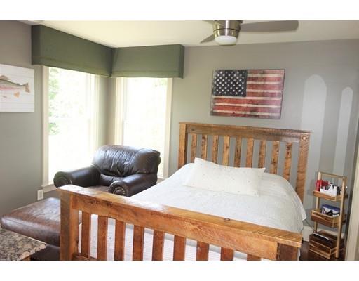 237 Pleasantdale Road Rutland, MA 01543 - Photo 17 of 42 a bedroom with a bed and wooden floor
